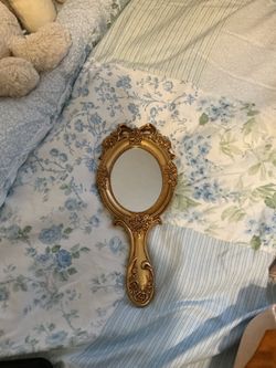 Small gold mirror