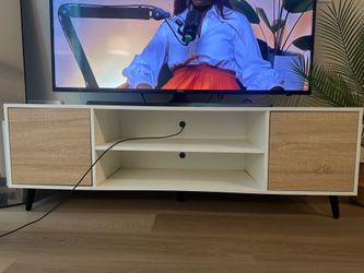 4’ 10” x 1.5’ white and wood finish TV Stand with storage compartments