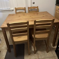 Wooden Table With Four Chairs