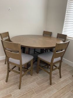 65” round table with 5 chairs