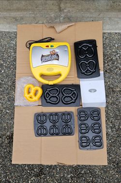 NEW (Open box) Nostalgia Electrics Stainless Steel 2 in 1 Homemade Baked Soft Pretzel Maker. $12