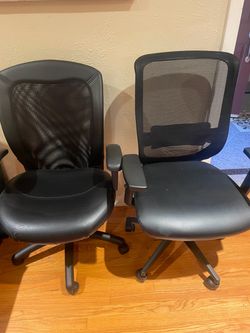 Two Black Mesh Office Chairs with Wheels