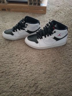 Youth white and black Jumpman jordans
