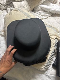 crush-proof EVA hard-shell travel cowboy hat carrier case featuring a durable black exterior and a molded grip handle