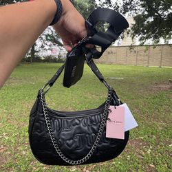New Juicy Couture Juicy Puff Half Moon black Crossbody Liquorice bag New with tags  Straps are adjustable Coin purse can be detached