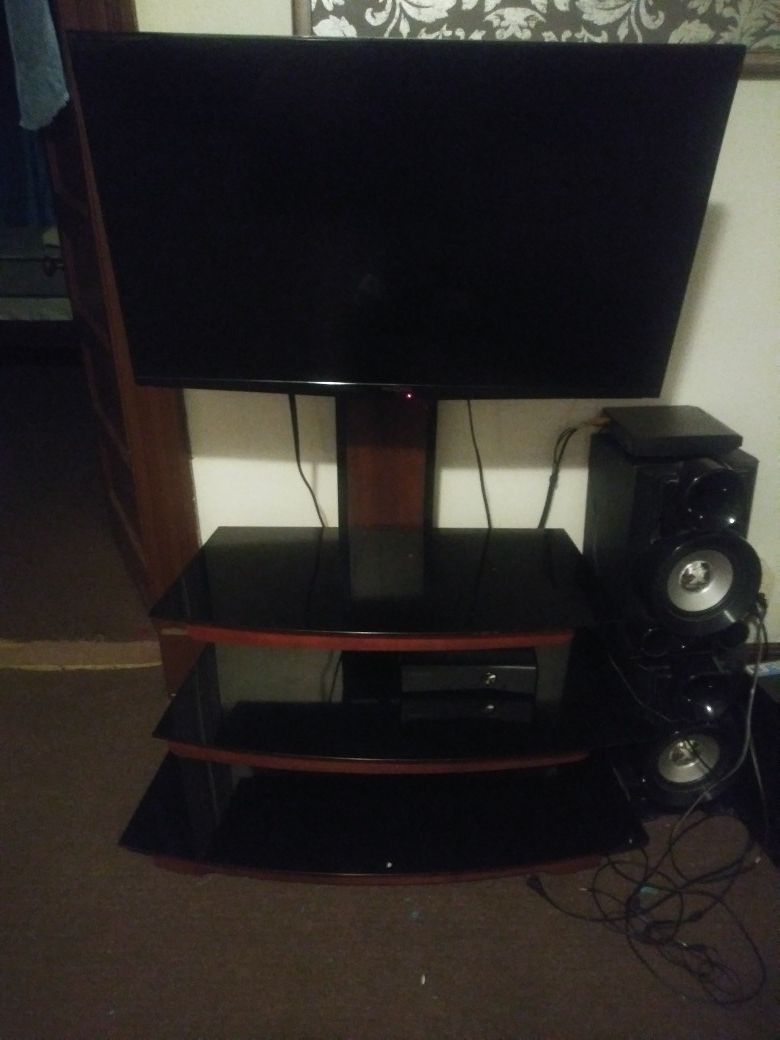 40-inch flat screen tv and tv stand.