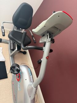 Seated bicycle exercise machine