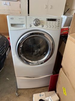 LG electric dryer with underneath storage