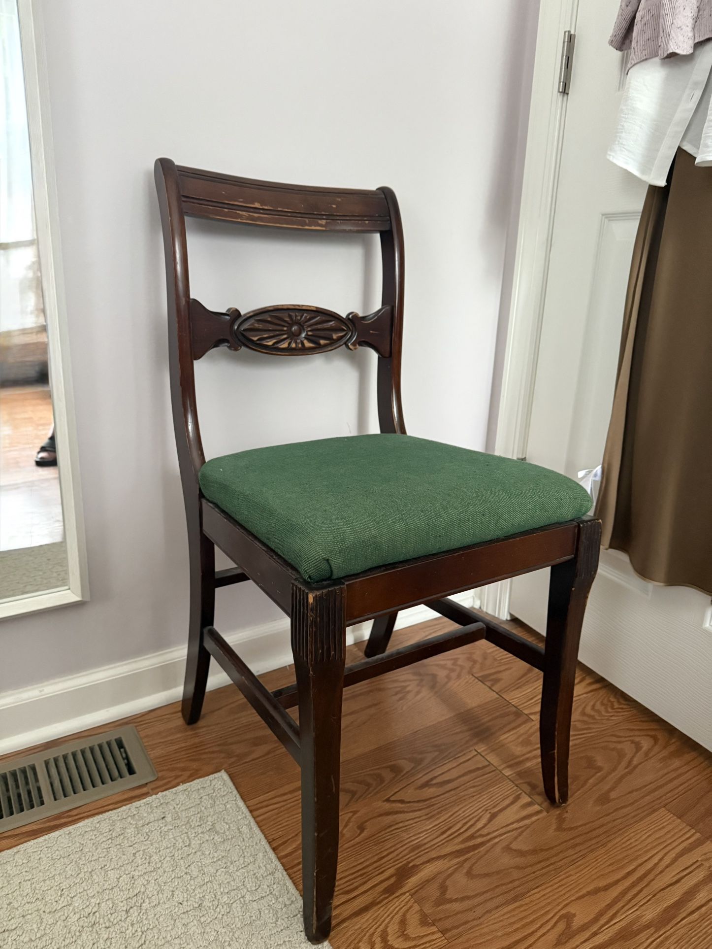 Antique wooden chair with new upholstery