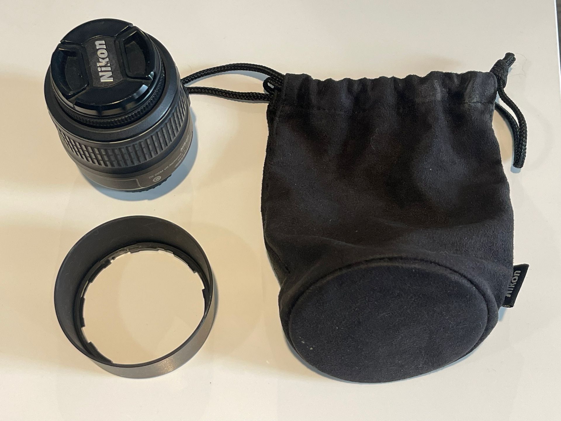 Nikon 18-55mm + Original Pouch + 2 Protective Covers.