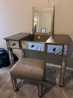 Makeup vanity with storage bench