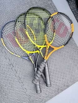 Lot of tennis racquets for sale.