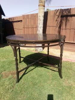 Round Dark Stone Top Iron Base Dining Table