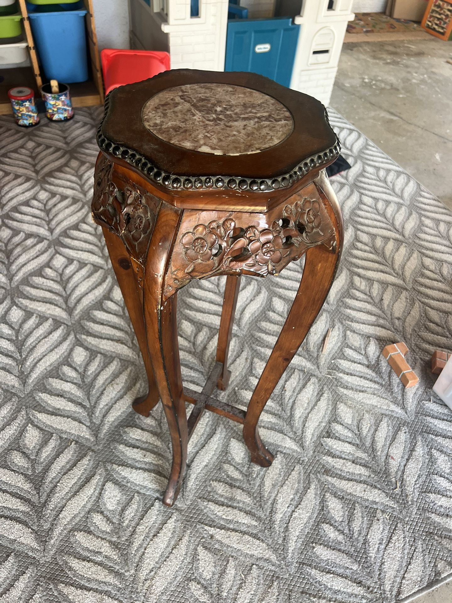 This is an antique Chinese carved rosewood and marble plant stand