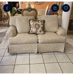 A Set Of Two Ivory Colored Sofas