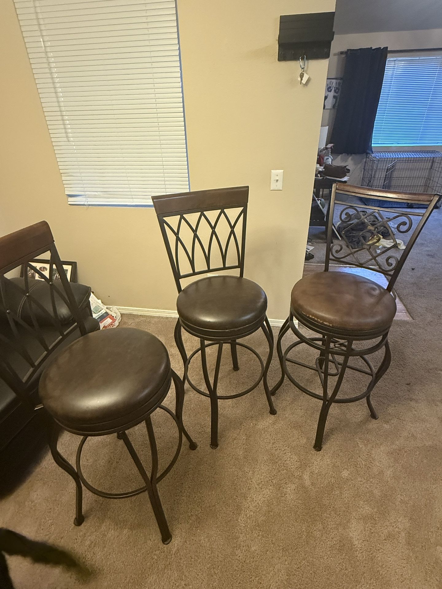 3 swivel Bar Stools 