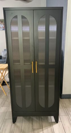 Black Two-Door Cabinet with Gold Handles