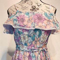 New Floral off the should with straps dress. For all occasions.  Size small to medium.  Stretch waistline. Has floral belt.