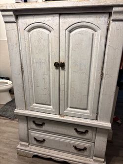 Distressed wooden armoire