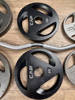 Olympic Curl Bar with Cast Iron Plates Three Grip: 35s, 25s, 10s and 5s. Total: 167 lbs