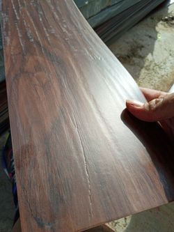 dark brown wood-look luxury vinyl plank (LVP).