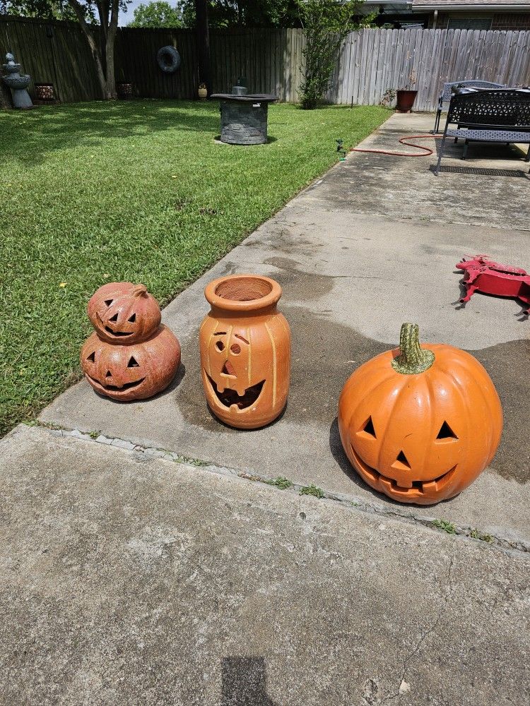 Clay pumpkin see pictures for measurements. The one on center has cracked. Price is for the two on the sides. Thick clay, heavy. $125