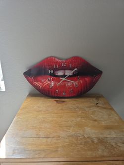 Women's red lips. Shaped wall clock.
