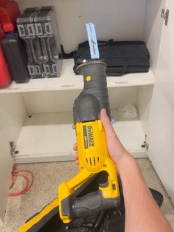 DEWALT 20V MAX cordless power tool kit with 7 different tools, batteries, and a carrying bag.