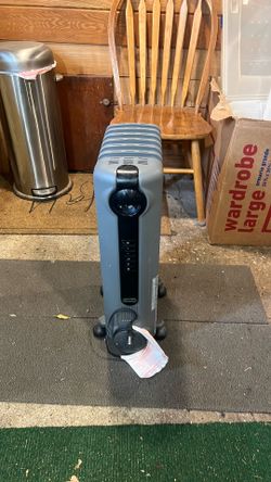 Oil filled heater with thermostat.
