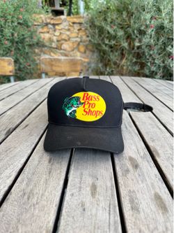 Black Bass Pro Shops mesh trucker cap features the iconic leaping bass logo