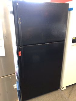 Used GE 18 cu ft top and bottom fridge. 1 year warranty