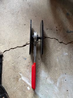 Brake pad spreader