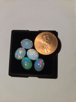 Genuine natural opal gems with lots of rainbow colors