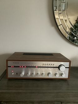 * WINTEC * VINTAGE STEREO RECEIVER IN MINT BRAND NEW CONDITION . MUST BE SEEN TO APPRECIATE . WOOD CASE CABINET . 