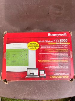 Honeywell Wi-Fi VisionPRO 8000 touchscreen thermostat (model TH8320WF1029).