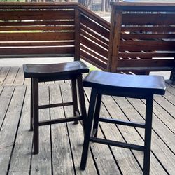Two wooden dark brown bar stool chairs. $35 for the set. 