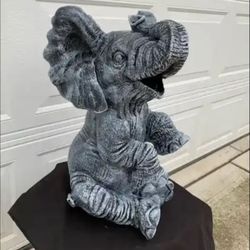 Large, happy elephant statue