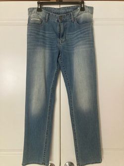 Brand New! Light wash Calvin Klein Jeans with a straight leg cut, button and zip fly closure, and five-pocket styling. Men Size 32x30.