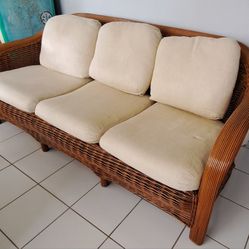 Wicker couch, love seat, and side table