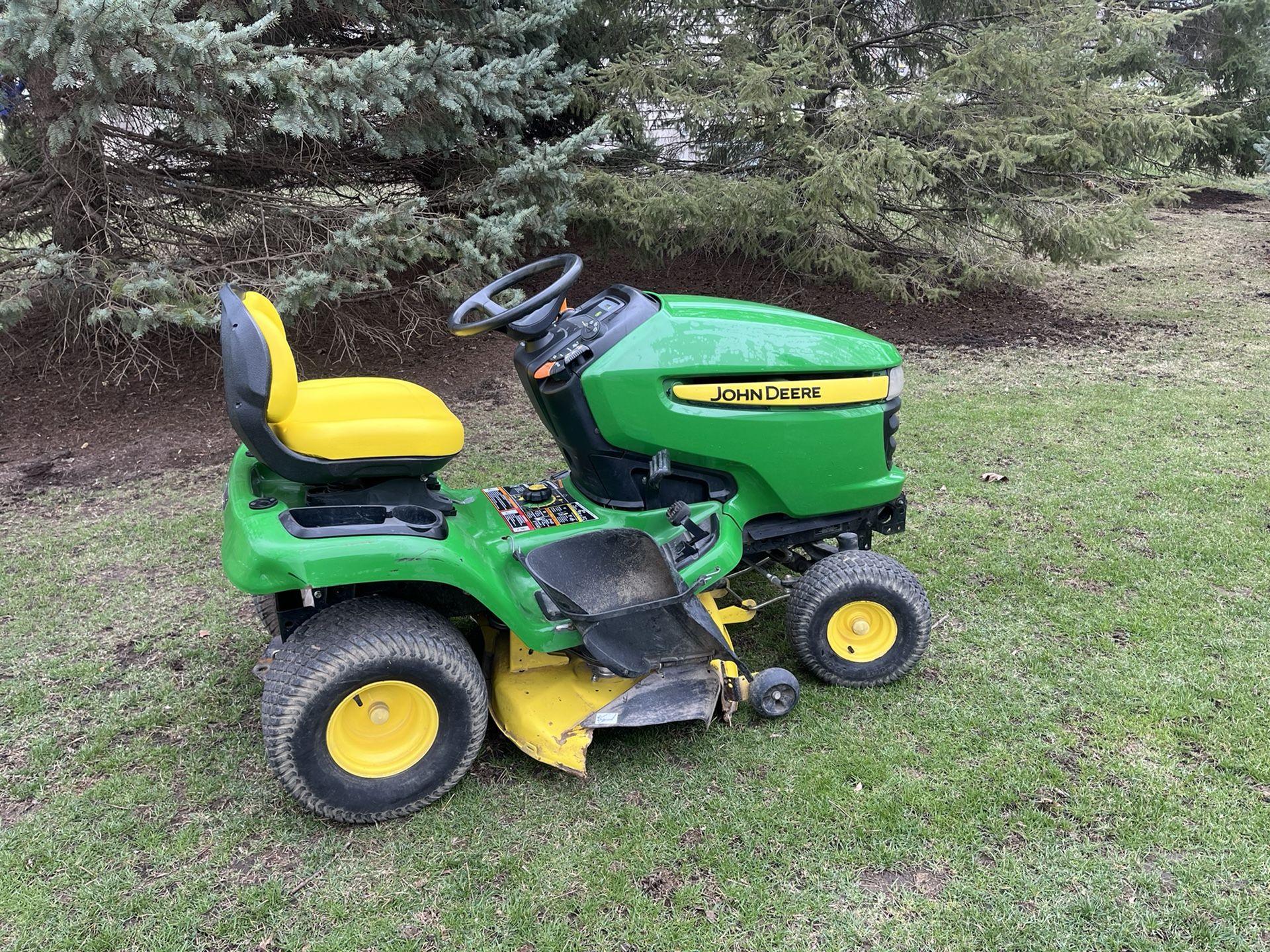 John Deere X310 Garden Tractor Riding Lawn Mower With A 42 Inch Deck And Kawasaki Motor 