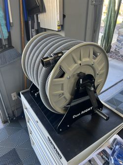 Dust Collection Or Vacuum Hose On Wall Mounted Reel