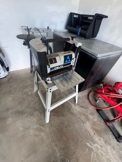 Delta Shopmaster planer, likely model TP400LS.