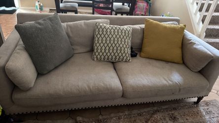 Grey sofa with pillows