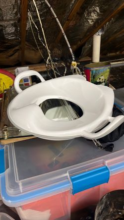 Baby toilet seat, unused. We somehow ended up with too many