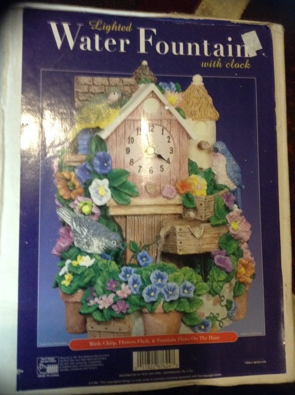 Lighted water fountain with clock