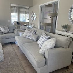 Gray couch and oversize chair