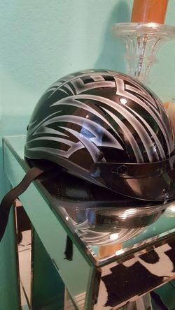 Black and silvet design motorcycle helmet...size xs...Great condition!