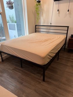 Queen size black metal bed frame with headboard
