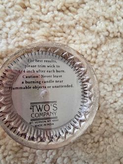 Candles in a stainless steel container