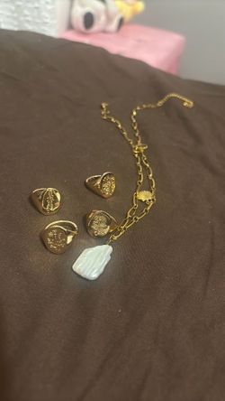4 rings and a necklace
